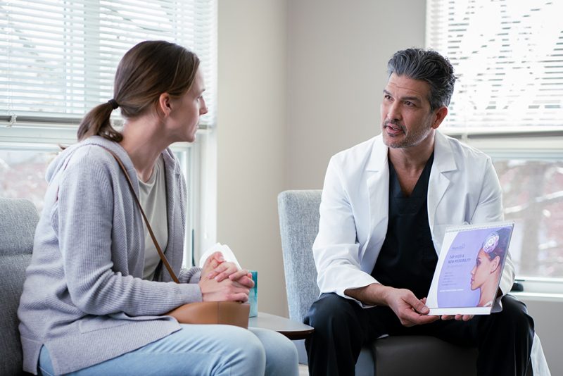 Patient Receiving a Consultation from a Doctor