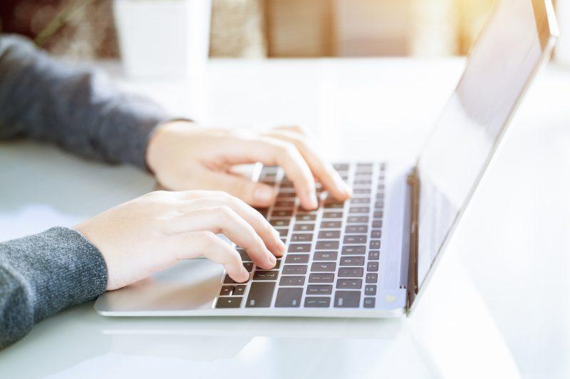 Typing into a laptop computer